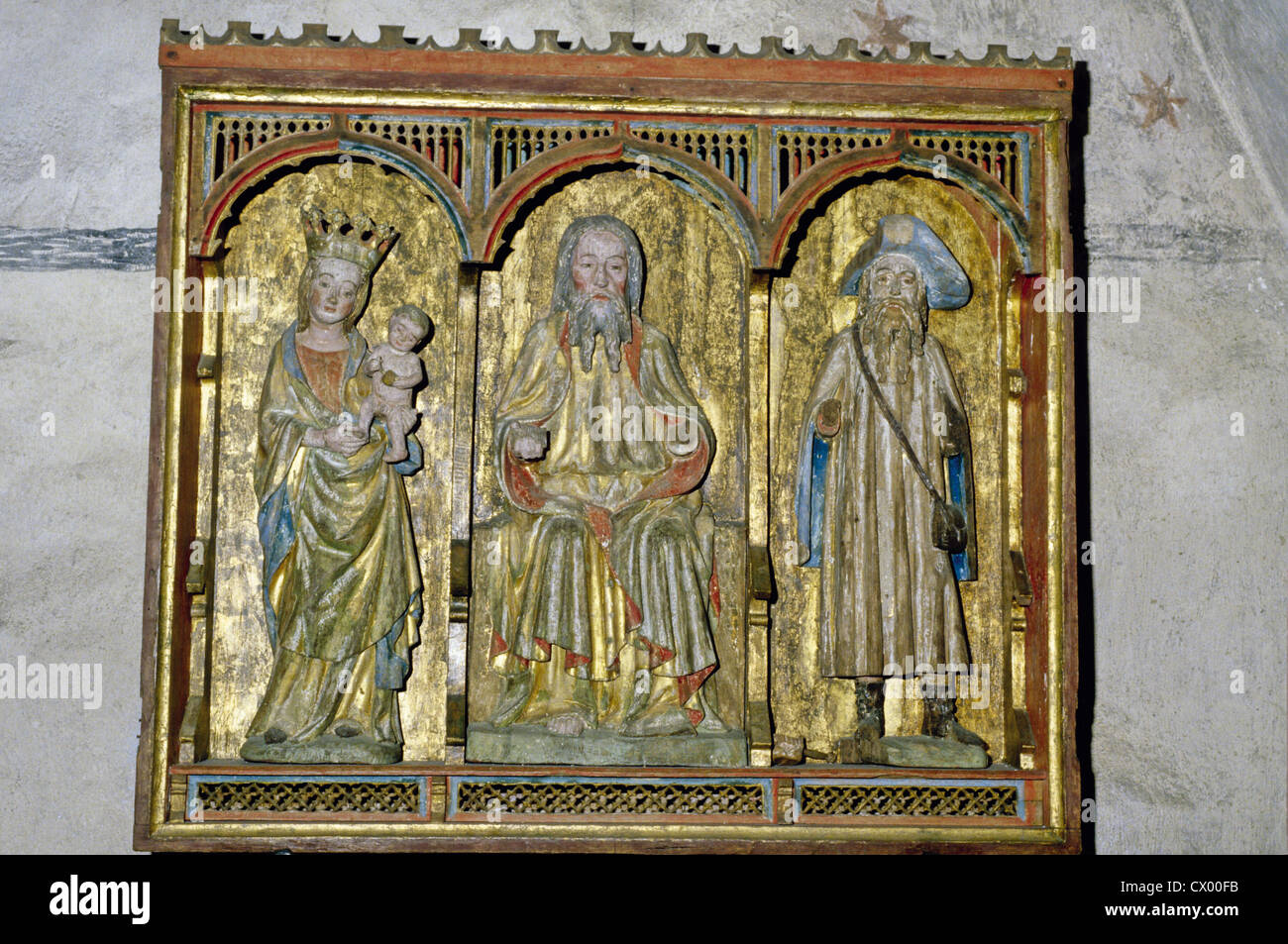 A triptych with three carved statues in the 15th century church at Rymattyla, Finland Stock Photo
