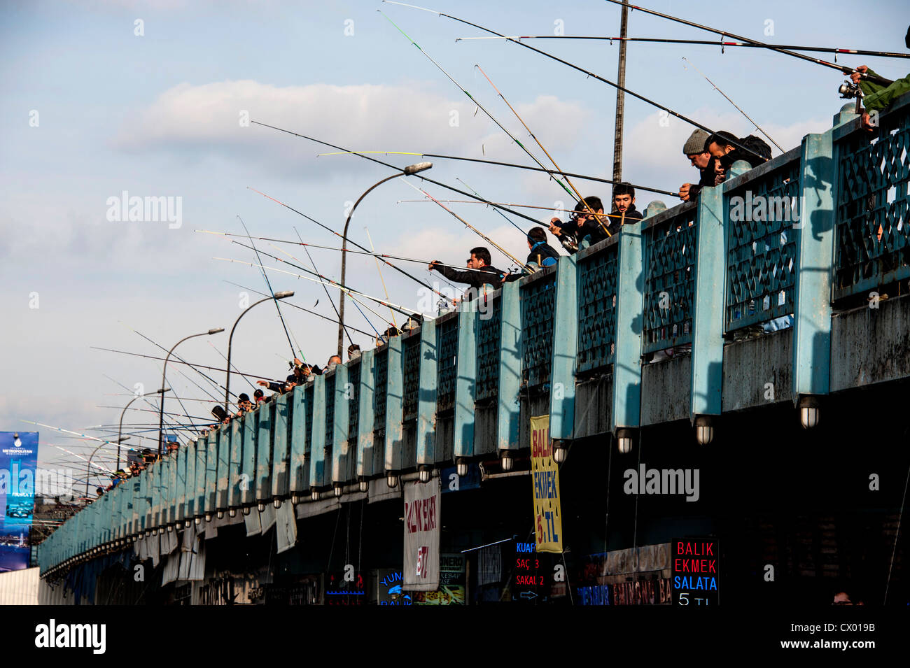 Fishing from the Galata bridge in Istanbul Turkey Stock Photo