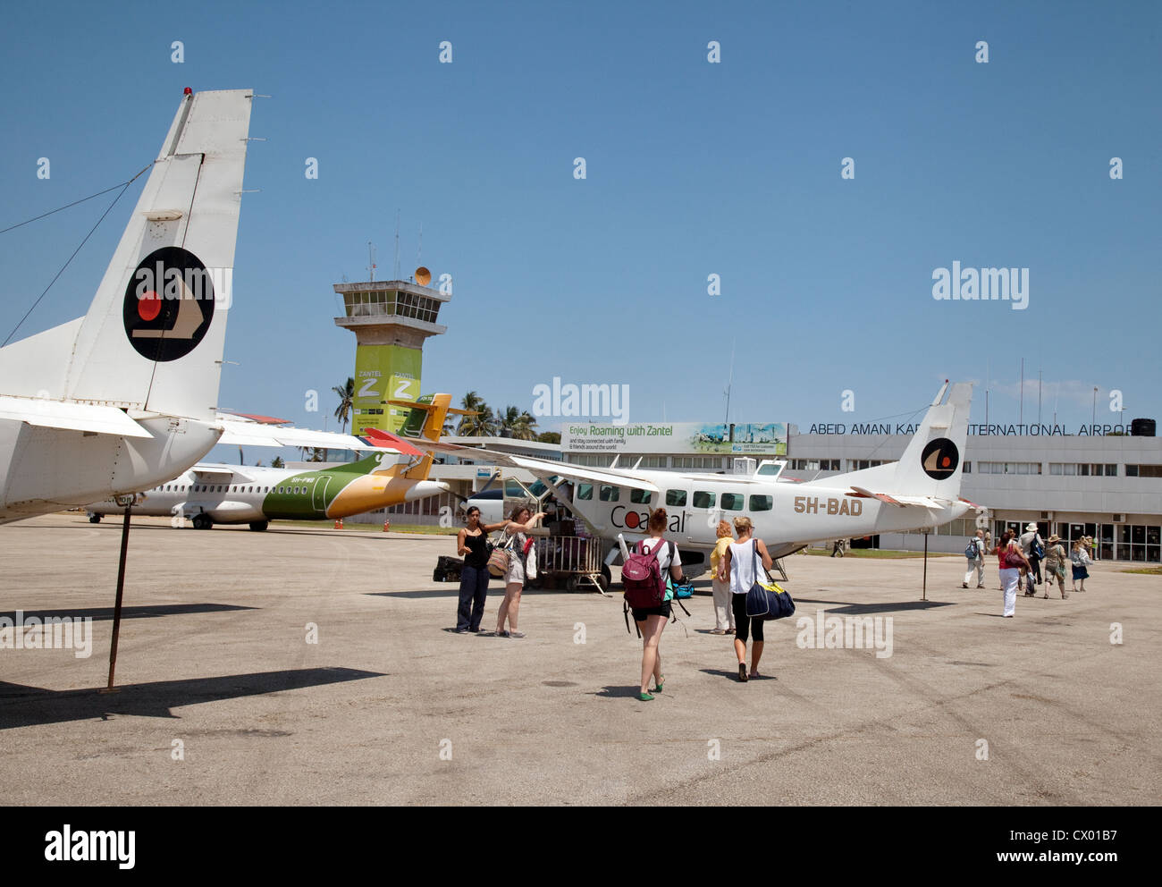 Tourists arriving by light aircraft at Zanzibar airport, Zanzibar Africa Stock Photo