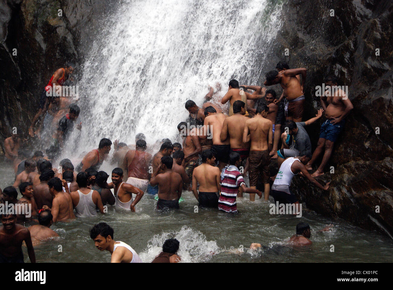 Lot of People Enjoying Bathing in Palaruvi Waterfalls.Scene from Palaruvi Water Falls at Kerala India Stock Photo