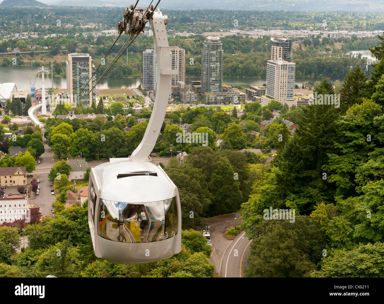 An aerial tram carries commuters aloft in Portland, Oregon Stock Photo