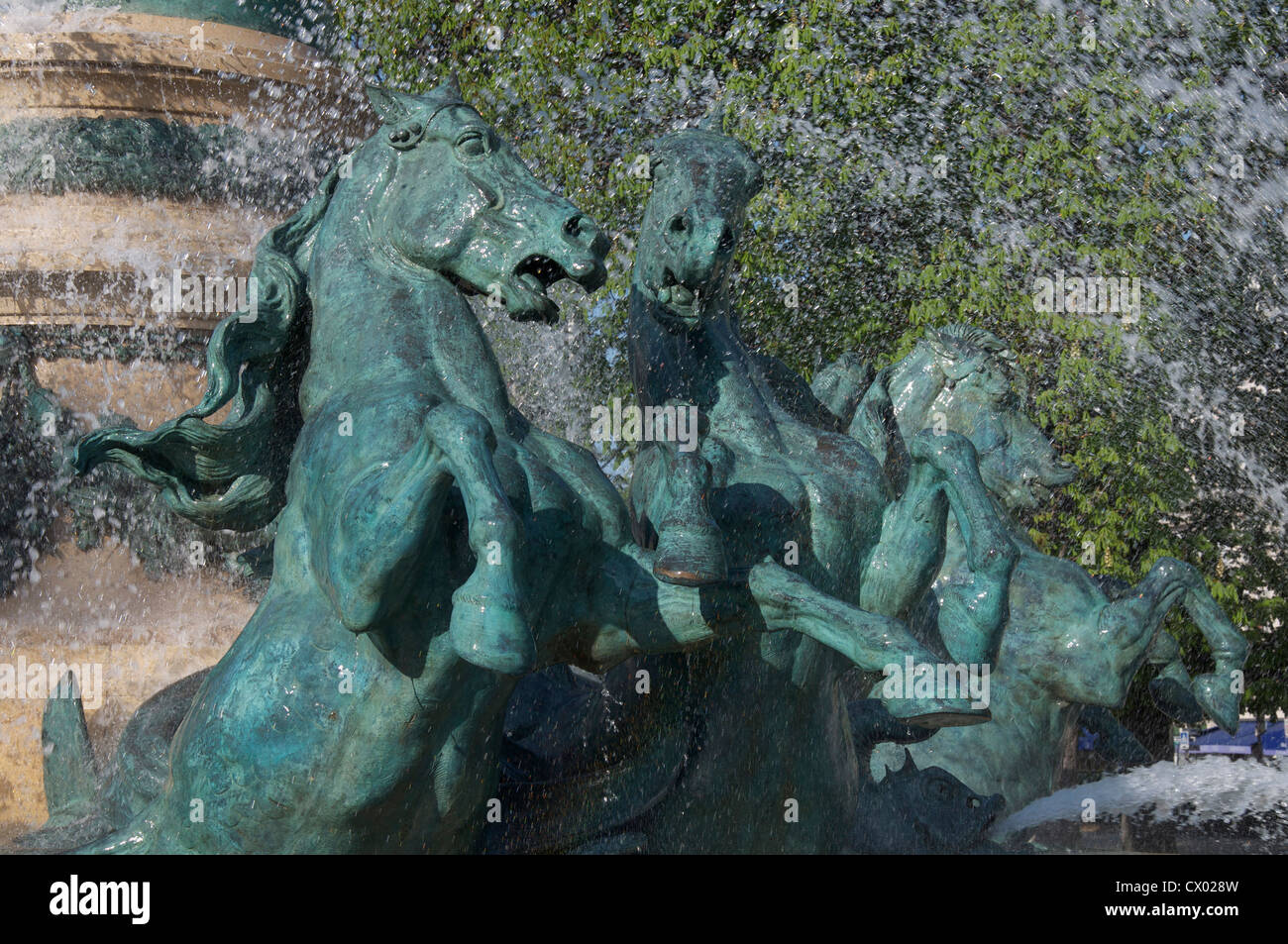 Fountains. Galloping horses charge through the water jets of the