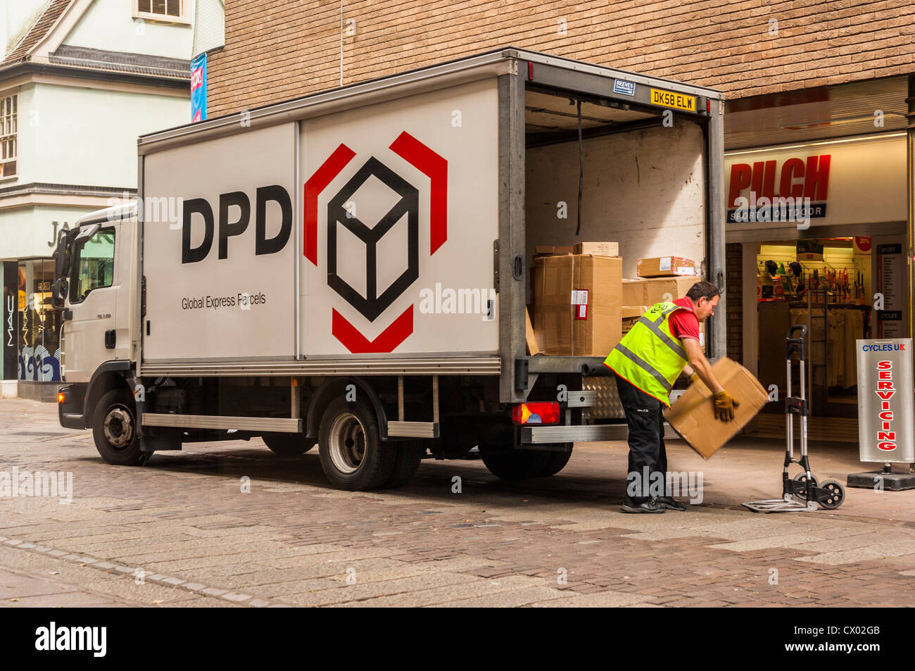 A DPD courier delivery van unloading parcels in Norwich , Norfolk ...