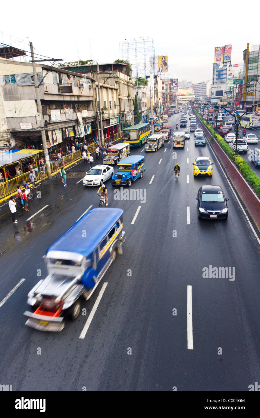 traffic in manila, with jeeps, car, taxi, and bicycles. Stock Photo