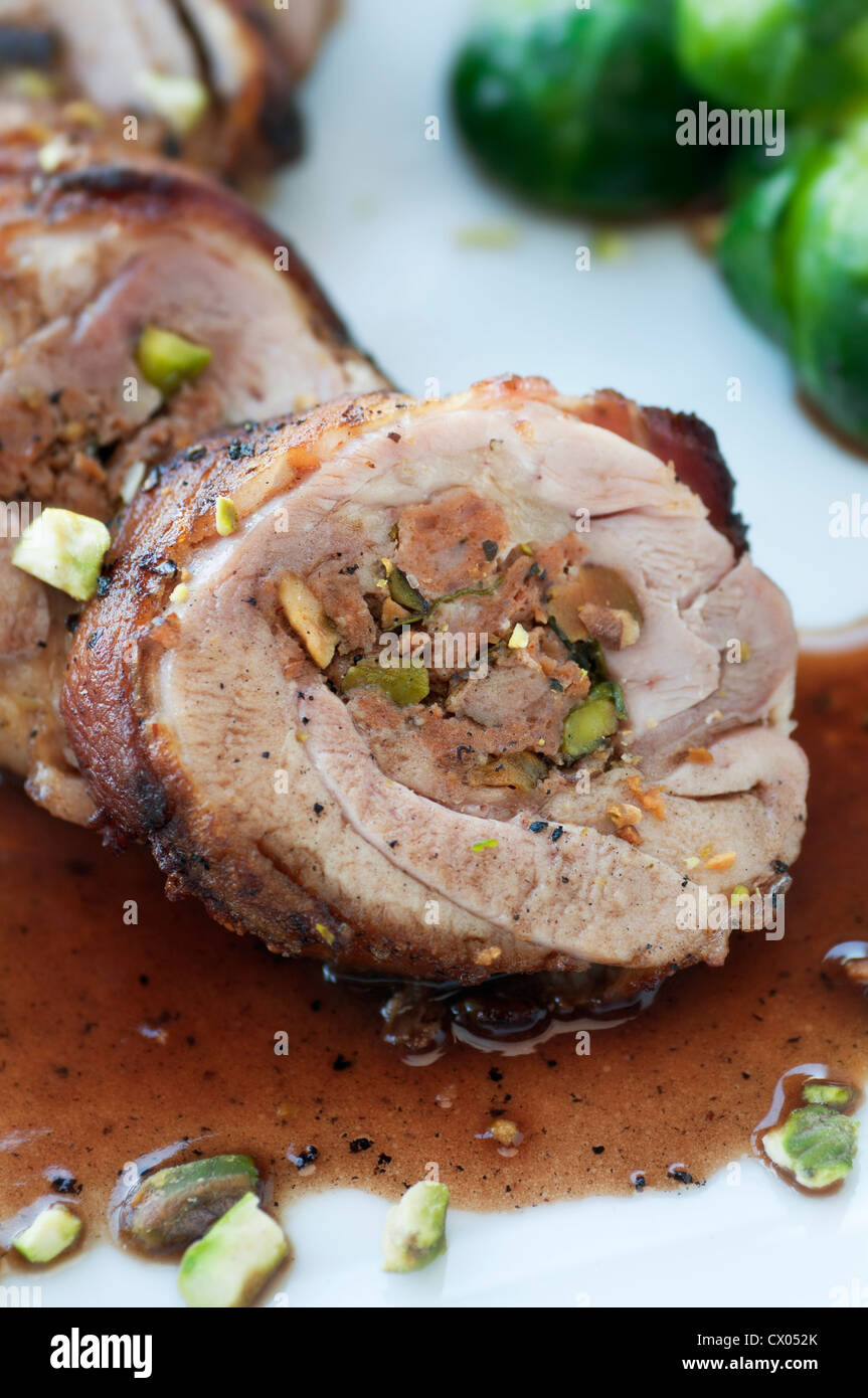 Bacon wrapped chicken thigh stuffed with wine sauce and brussel sprouts