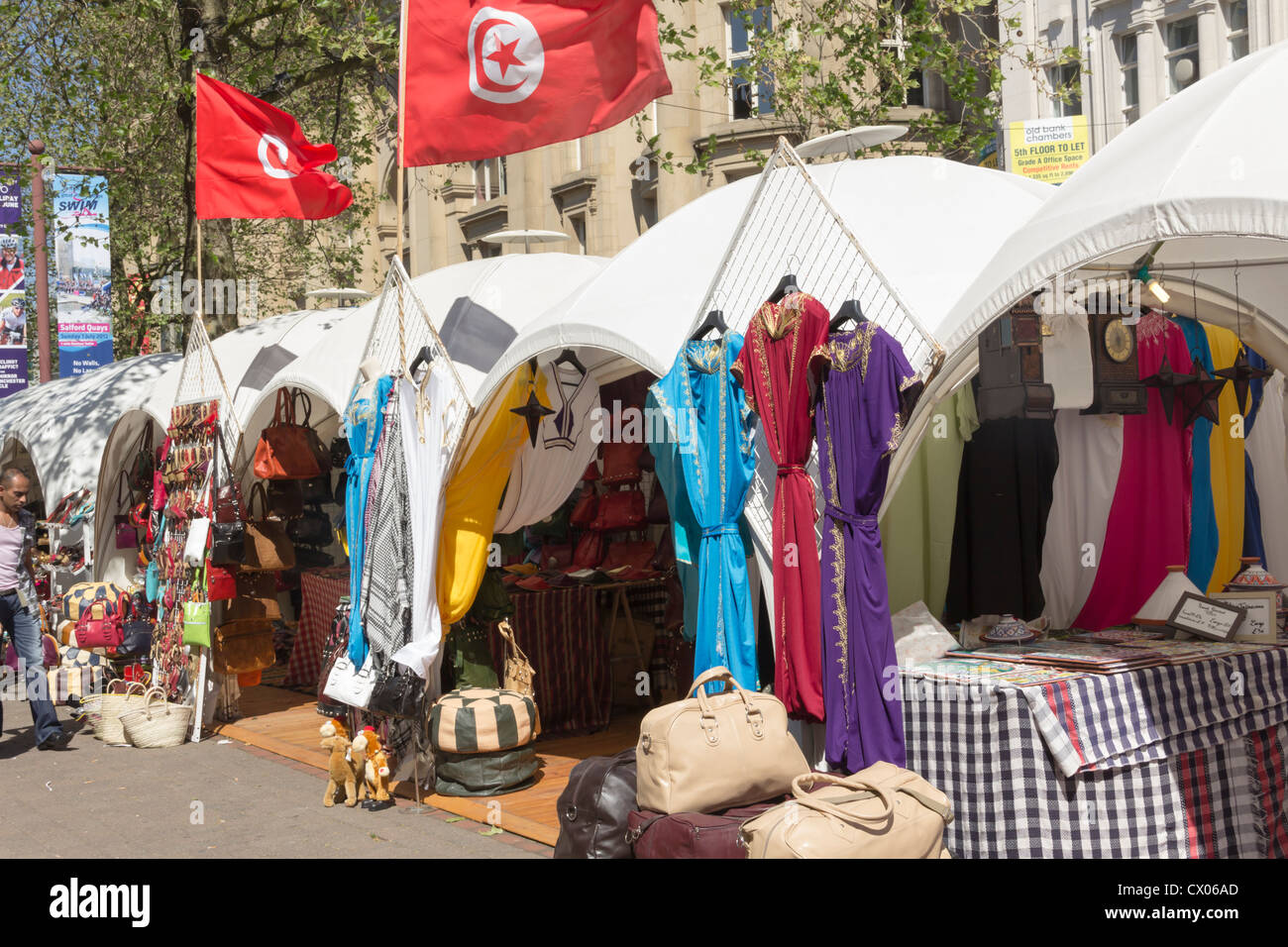 A line of stalls selling clothing and accessories at a Tunisian tourism promotional street market in Manchester in May 2012. Stock Photo