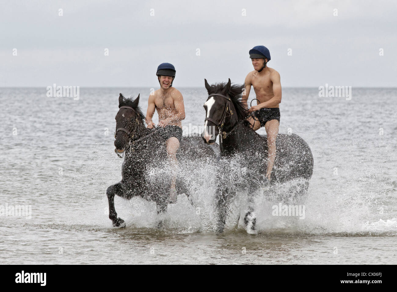 The Blues & Royals relaxing on Holkham beach, Norfolk, England Stock Photo