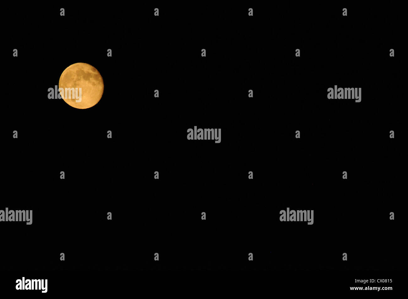 Full moon on the black background Stock Photo - Alamy