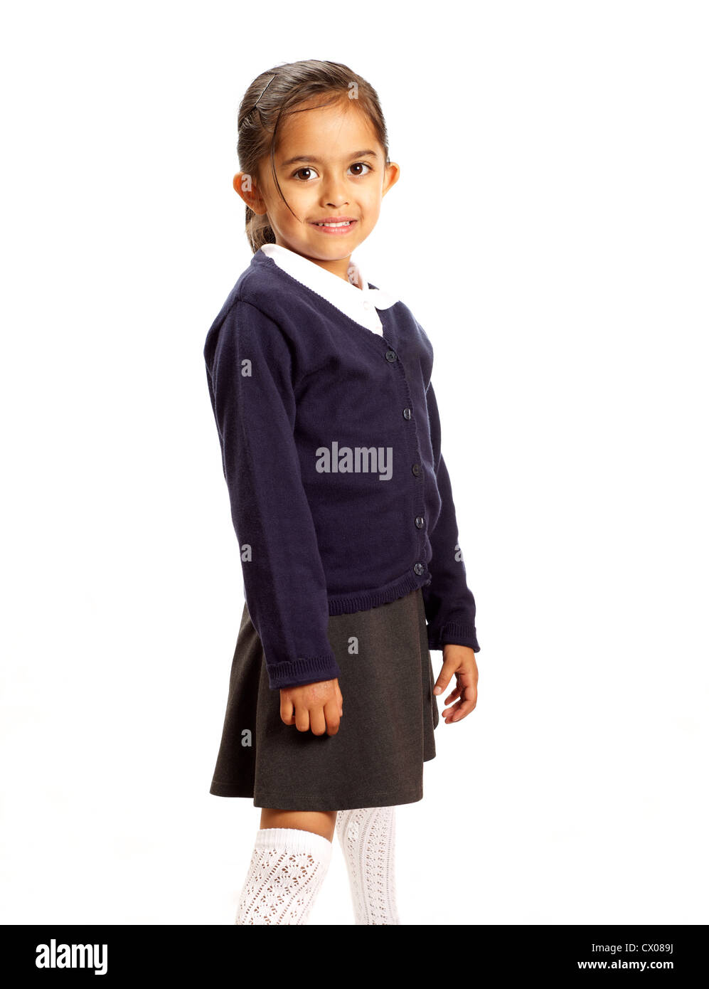 A young Asian schoolgirl in uniform, UK Stock Photo