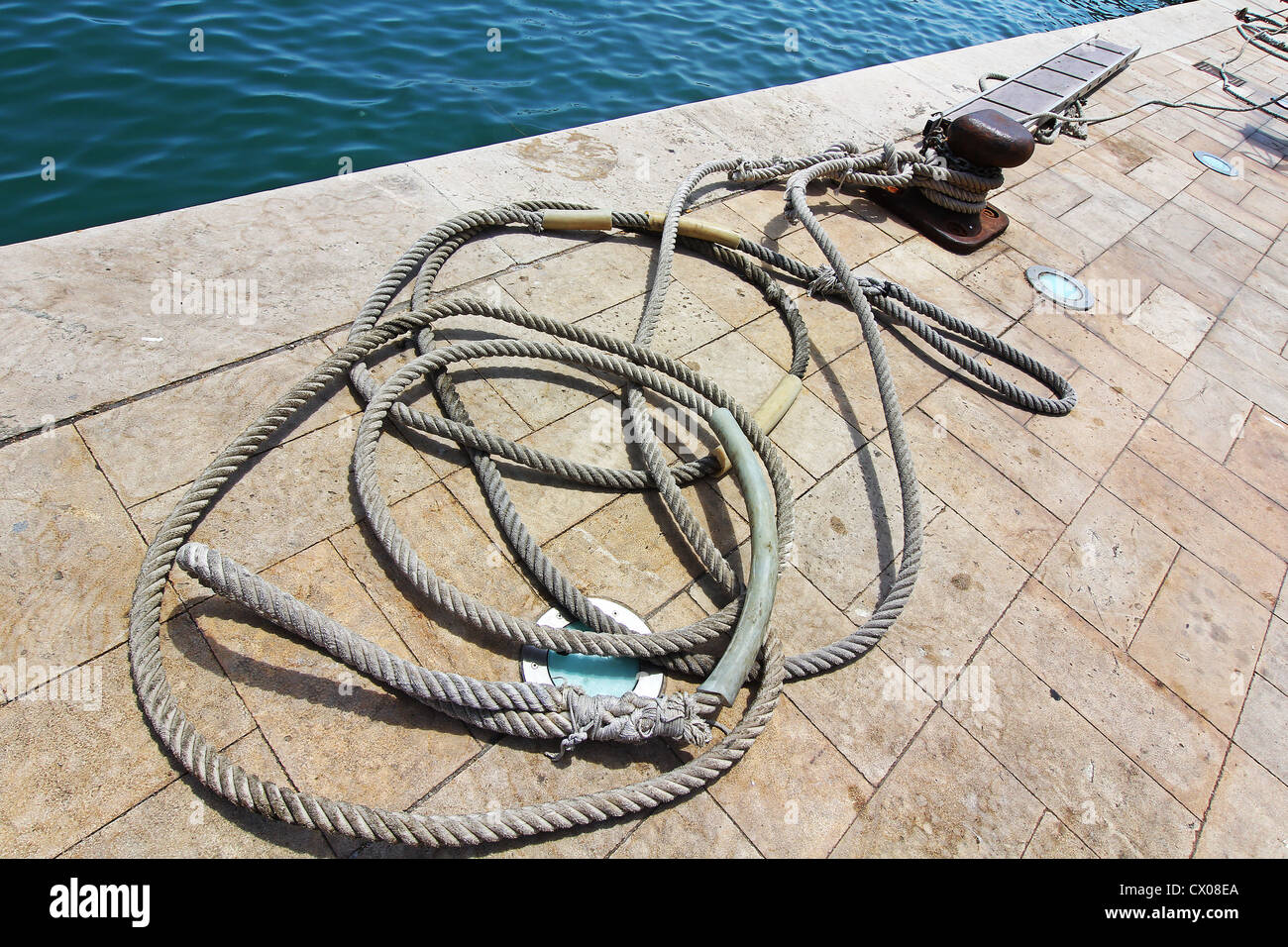 docks with ropes to tie boats Stock Photo Alamy
