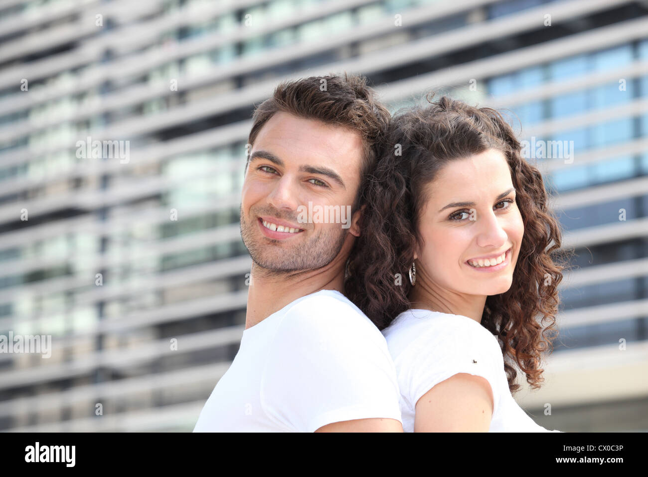 Couple outside office building Stock Photo - Alamy