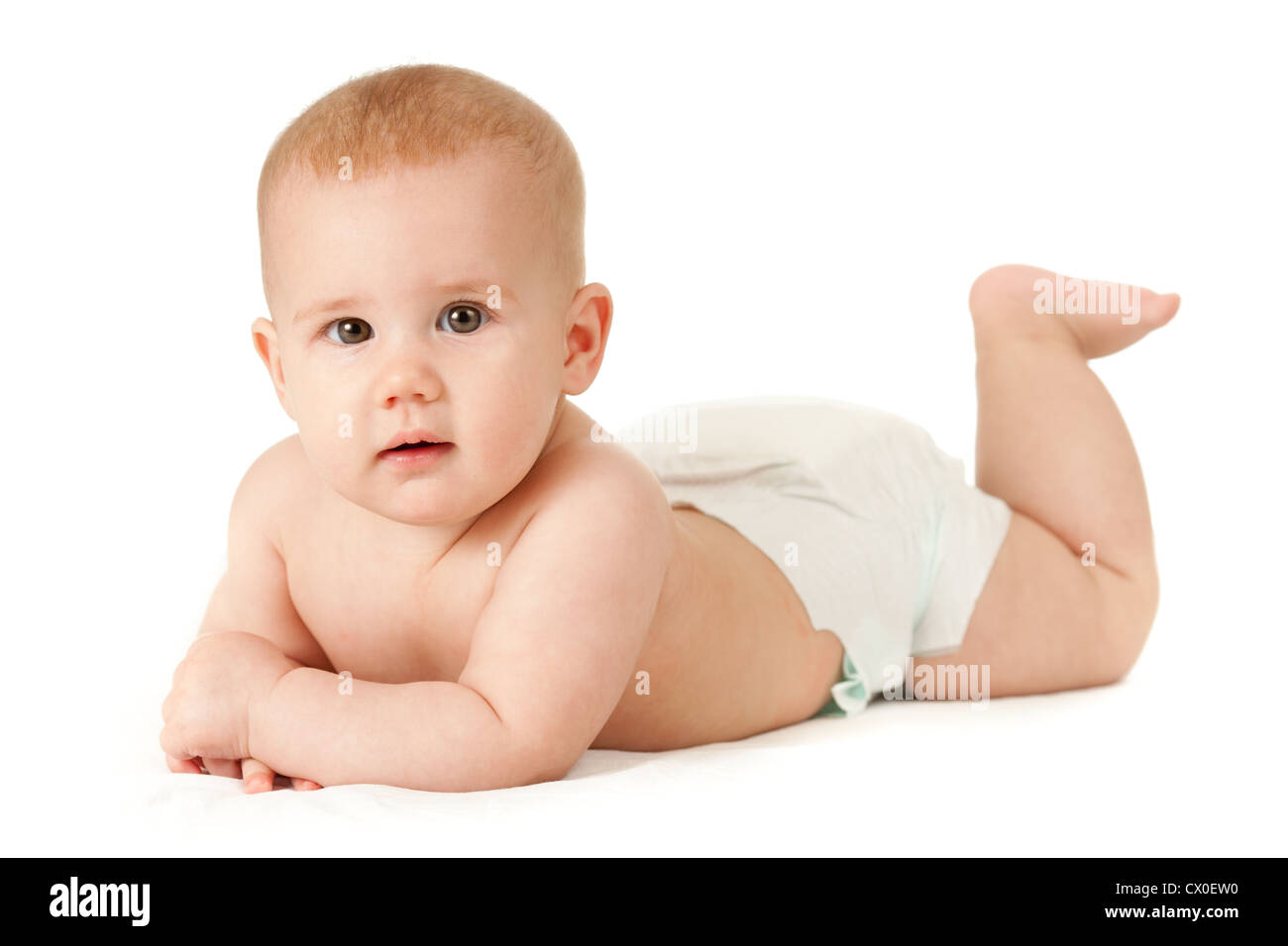 Baby girl in diaper lying isolated Stock Photo