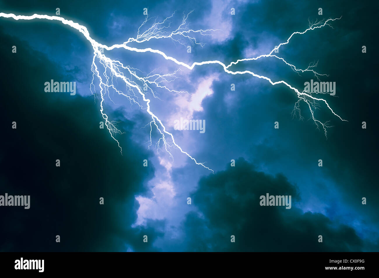 lightning bolt across dark storm clouds Stock Photo