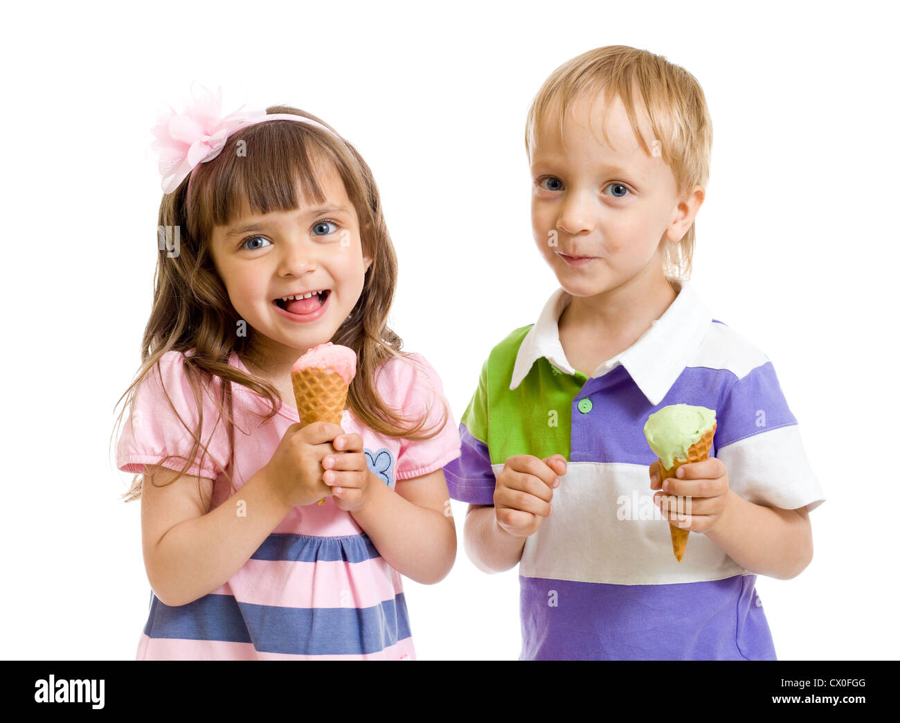 happy children twins girl and boy with ice cream in studio isolated Stock Photo