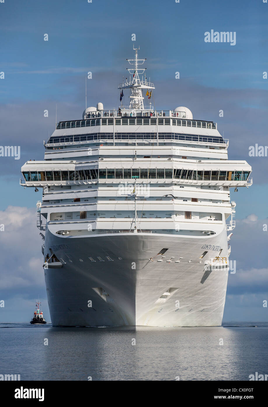 Large cruise ship with tugboat. Costa Pacifica in Reykjavik Harbor