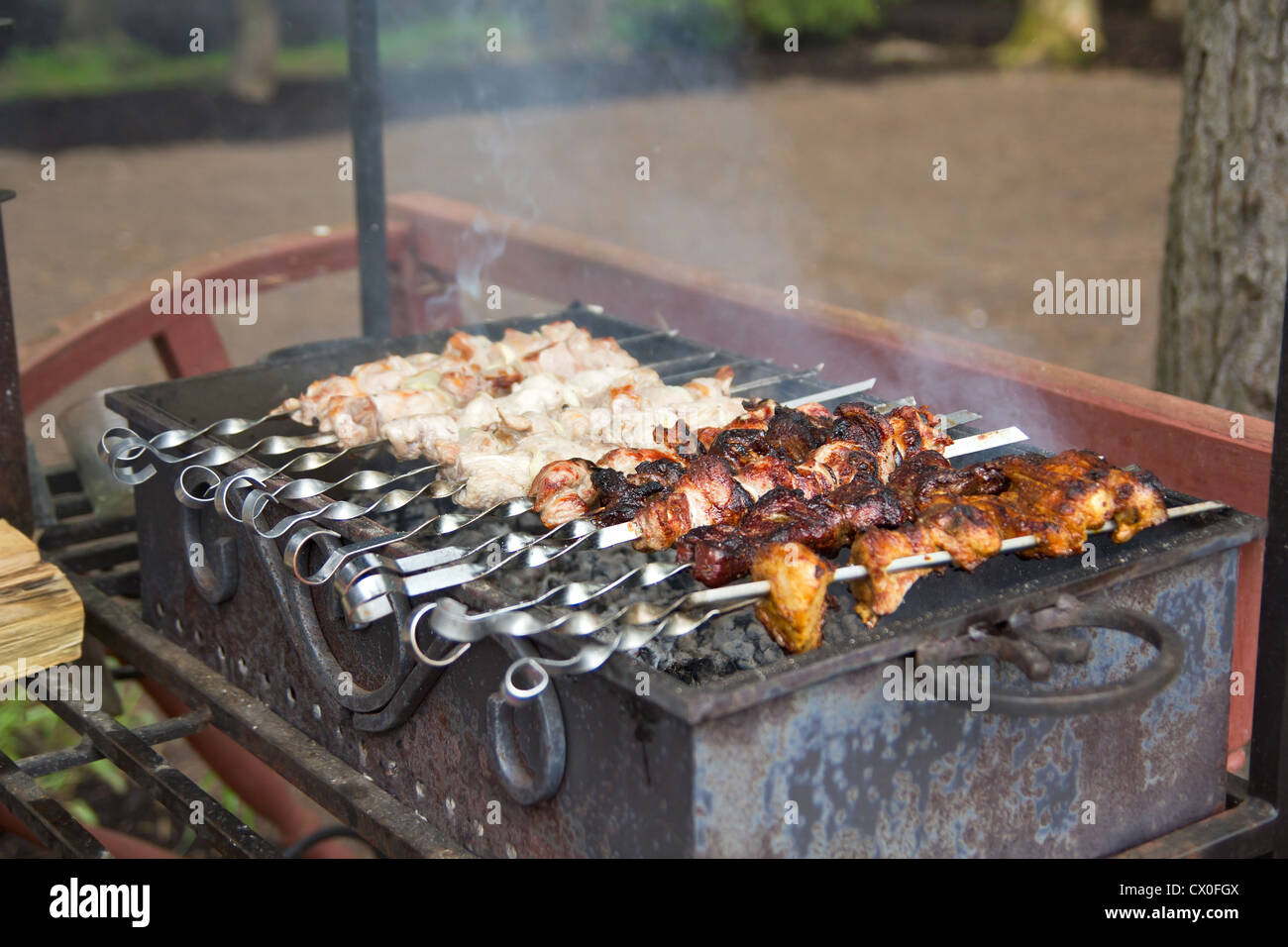 Process of cooking meat on barbecue, closeup Stock Photo Alamy