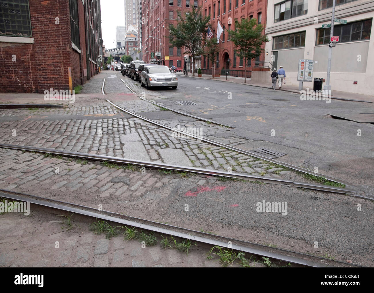 DUMBO, Brooklyn streets with cobblestone and old rail trolley tracks at the corner of Plymouth and Jay Streets. Stock Photo