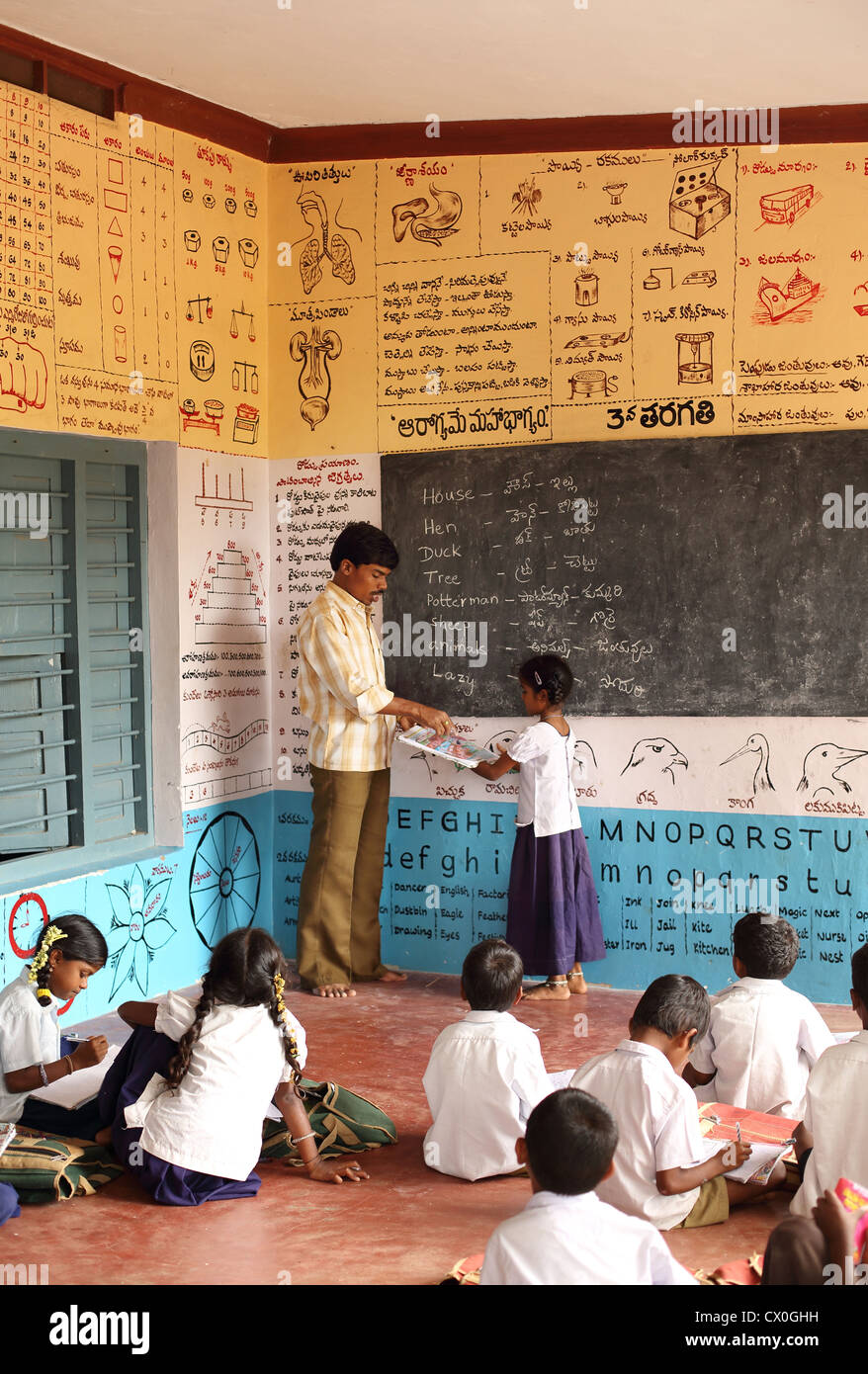 Indian school teacher with children Andhra Pradesh South India Stock Photo
