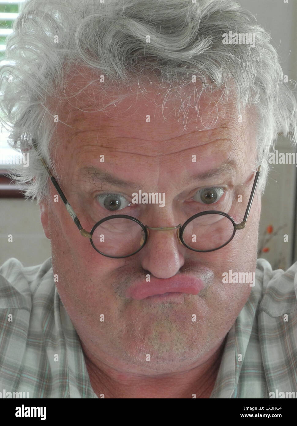 An ugly grumpy old man - fully model released images for any use Stock Photo