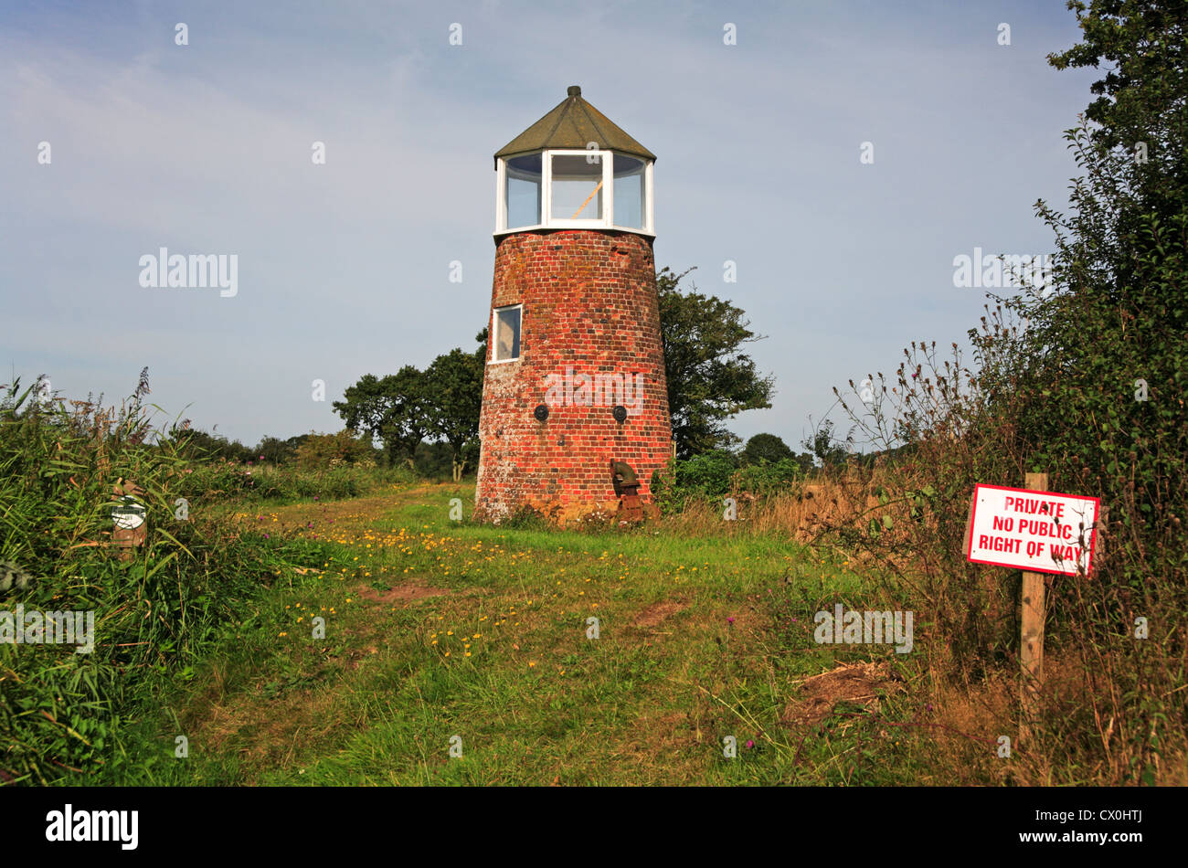 A private no public right of way sign by Hickling Broad Drainage Mill on the Norfolk Broads, England, United Kingdom. Stock Photo