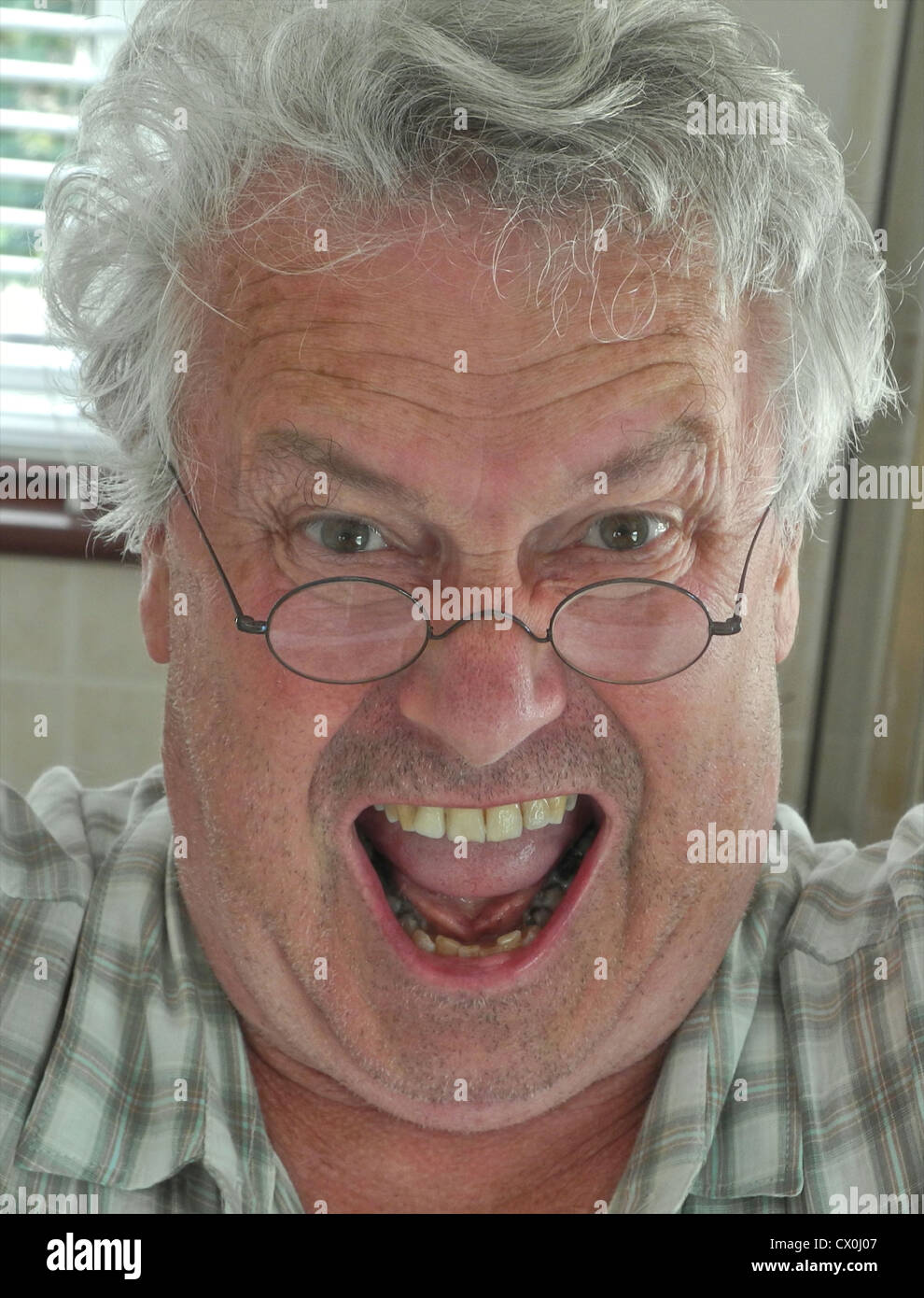 An ugly grumpy old man - fully model released images for any use Stock Photo