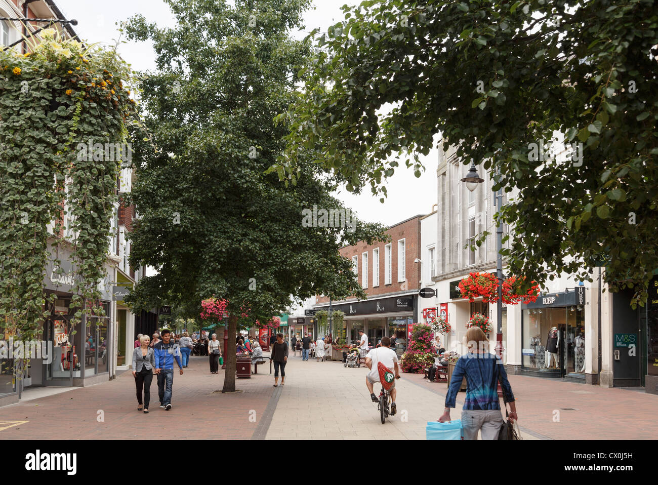 Street scene with shoppers in pedestrianised shopping precinct in the town centre in Royal Tunbridge Wells, Kent, England, UK Stock Photo