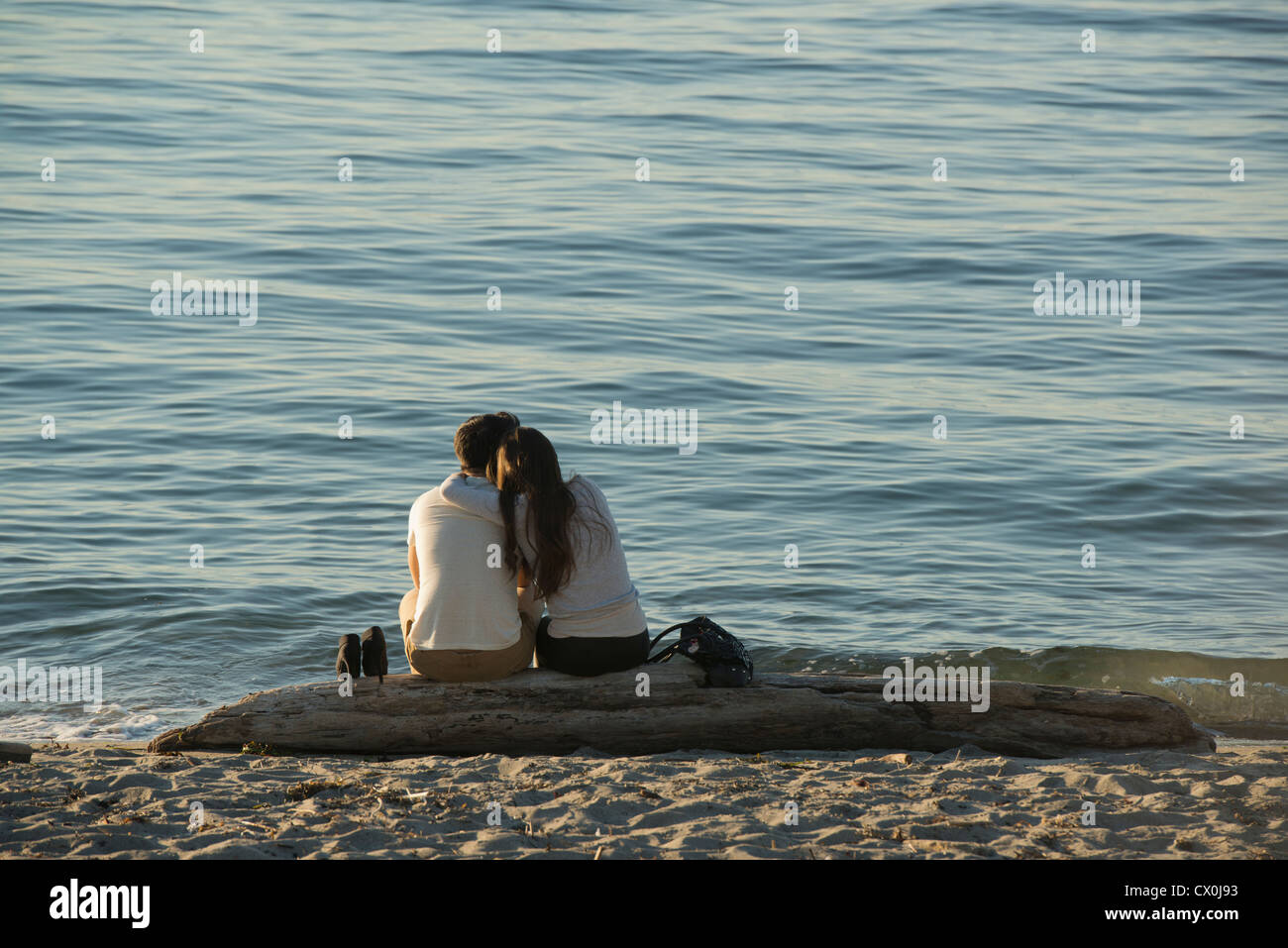 Couple on Alki Beach, Urban recreation area, Seattle, Washington SUMMER Stock Photo