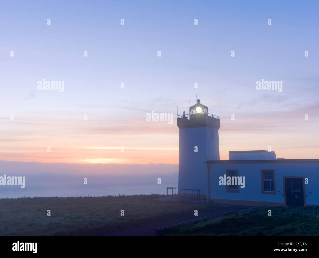 Duncansby Head lighthouse at dawn, near John o' Groats, Highland, Scotland, UK. Stock Photo