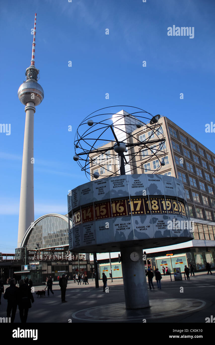 The clock in the world made by Eric John with behind the TV tower at Alexanderplatz, Berlin, Germany Stock Photo