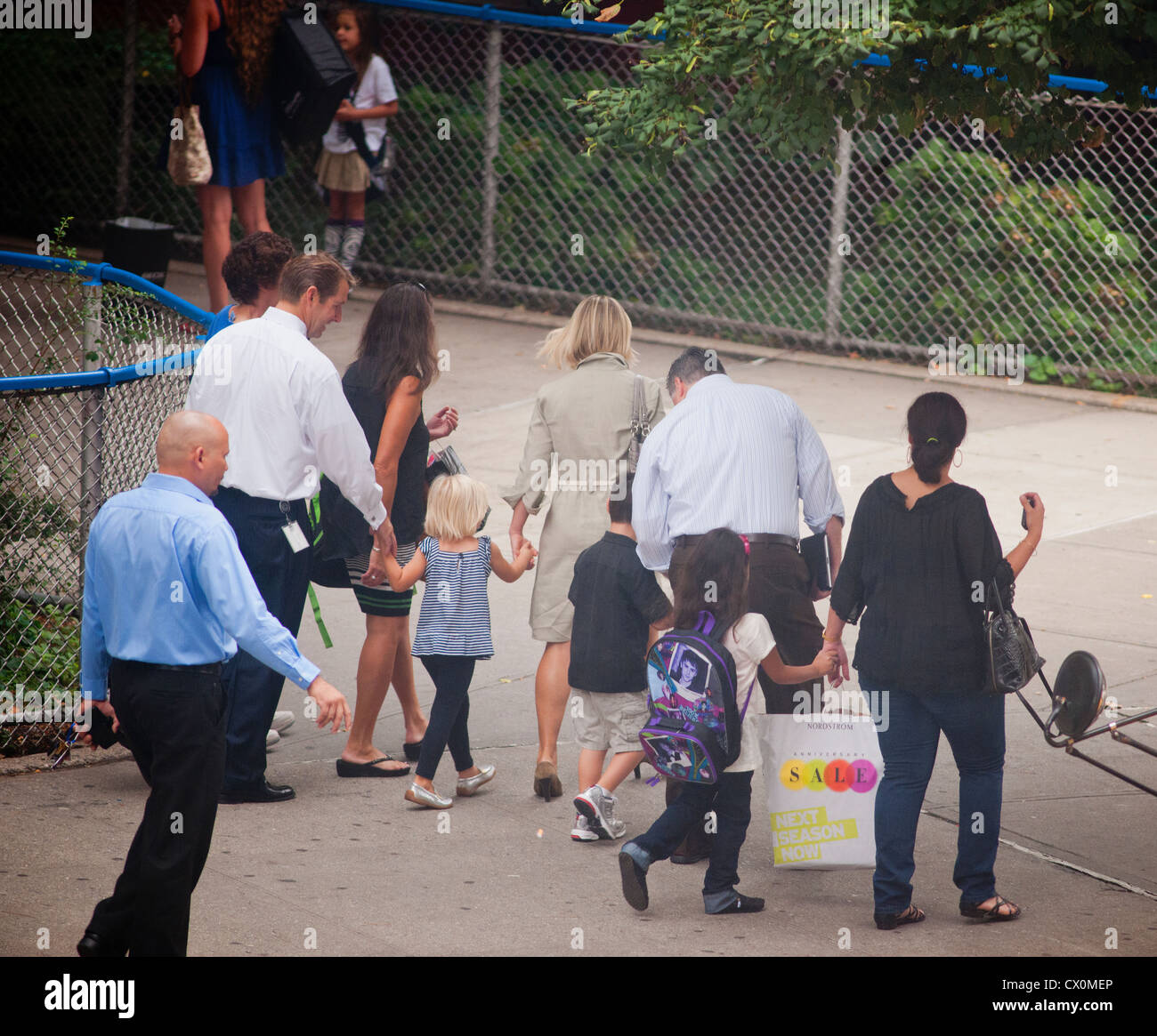 Parents and children arrive at a school in the New York neighborhood of Chelsea for the first day of class Stock Photo