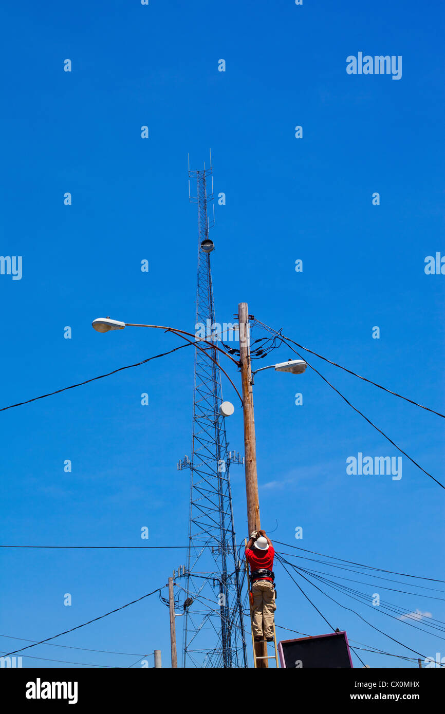 A repair man fixing cables, Atlanta, USA Stock Photo Alamy
