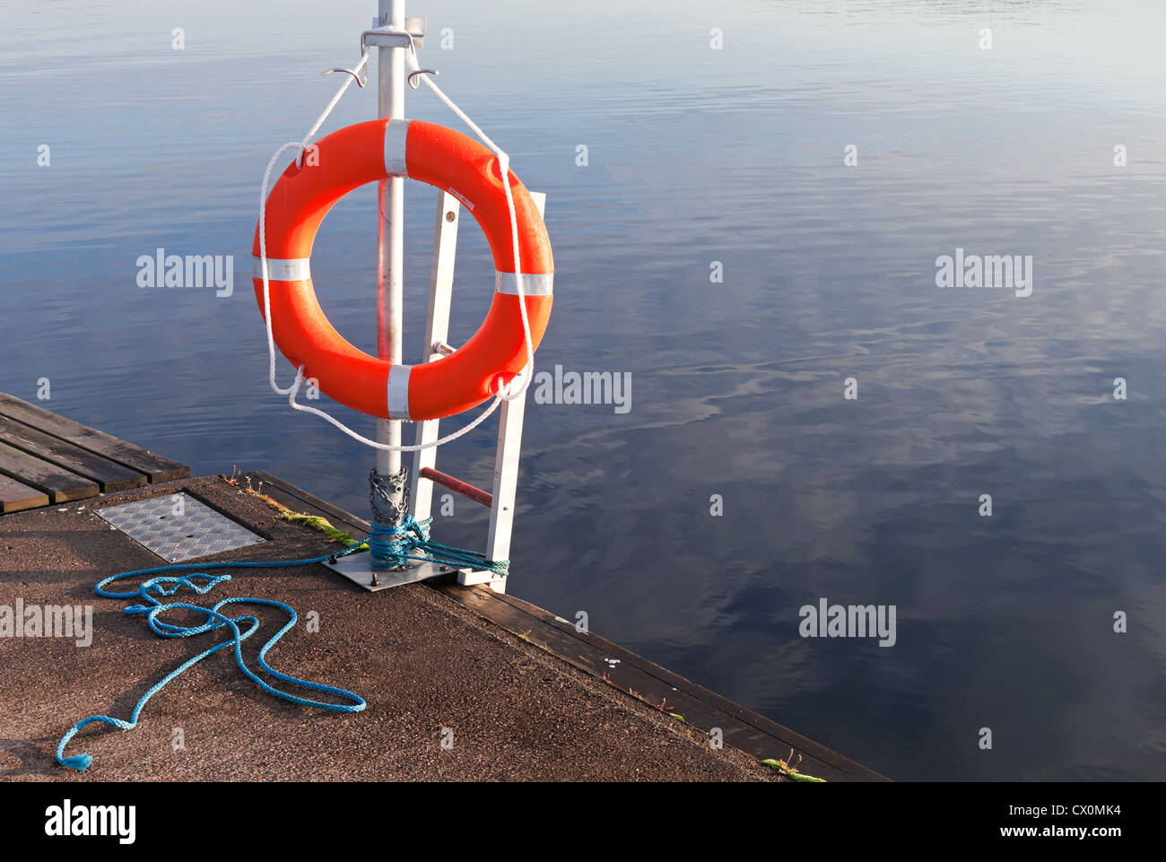 Safety equipment. Red lifebuoy on the pier Stock Photo