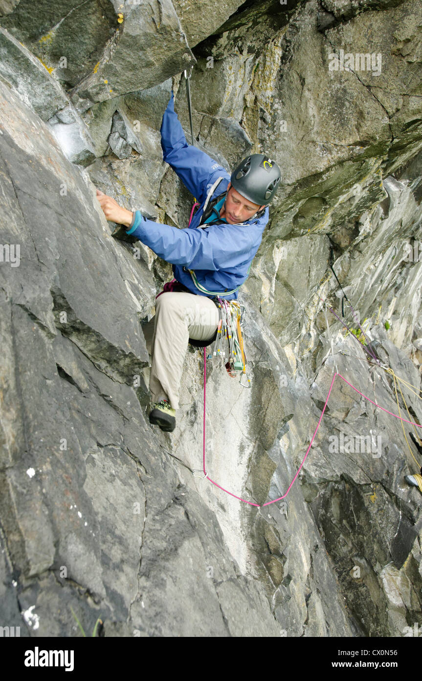 Rock climbers on the Girdle Traverse at Carreg Hylldrem Stock Photo