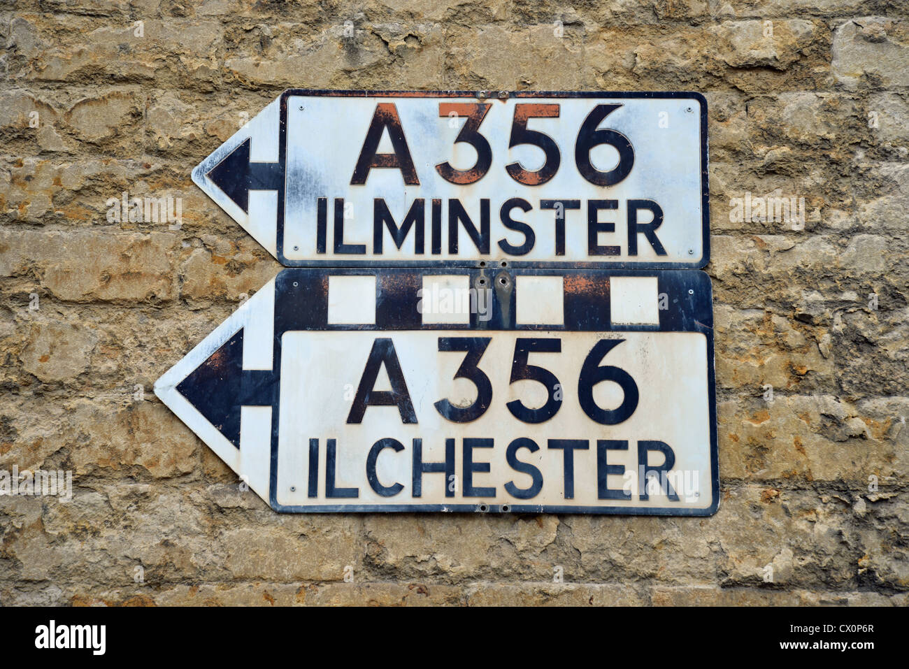 Period traffic signs to Ilchester and Ilminster in Market Square, Crewkerne, Somerset, England, United Kingdom Stock Photo