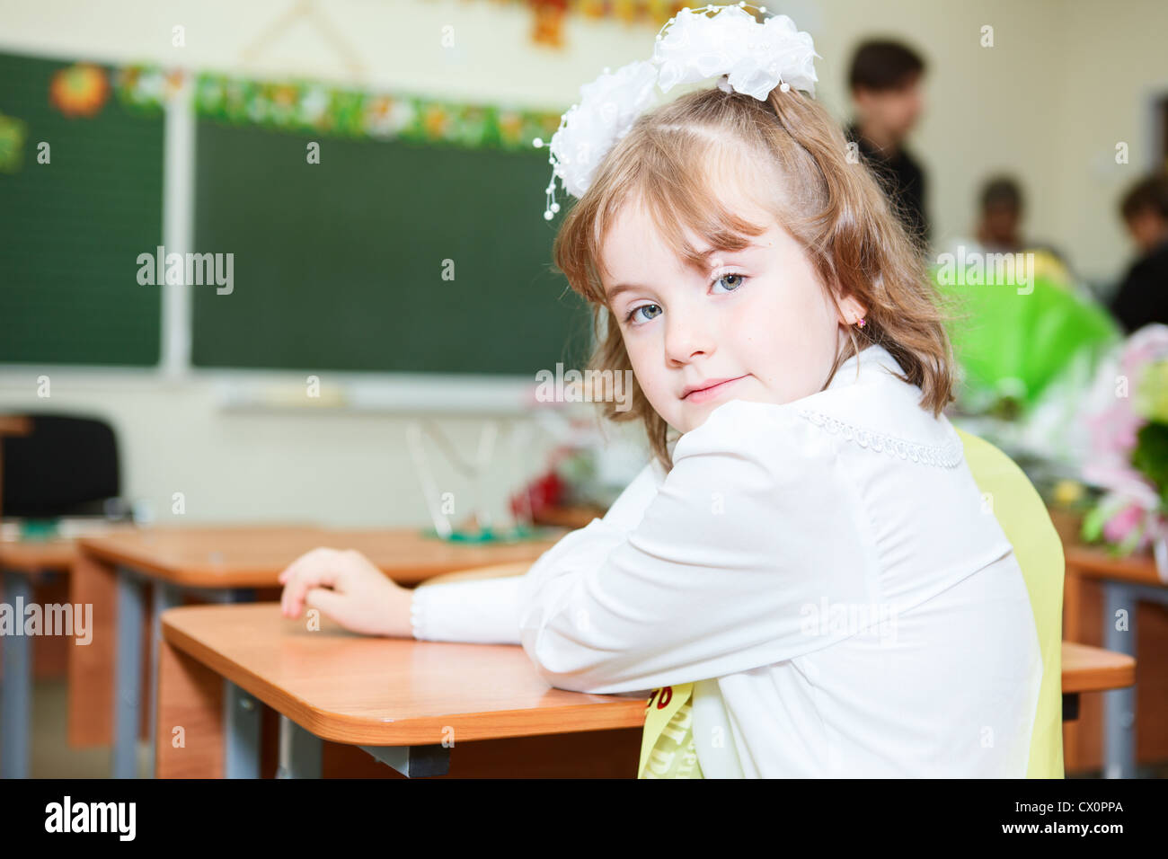 Russian Elementary School uniform Small girl looking back and sitting at desk in uniform, Russian elementary  school Stock Photo - Alamy