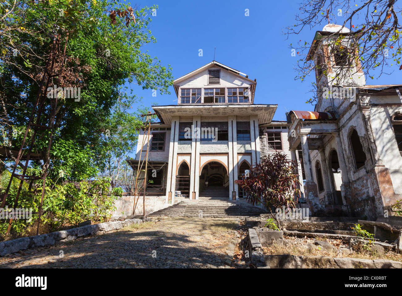 The administration building of the abandoned prison on Isla San Lucas, Costa Rica. The church is on the right hand side Stock Photo