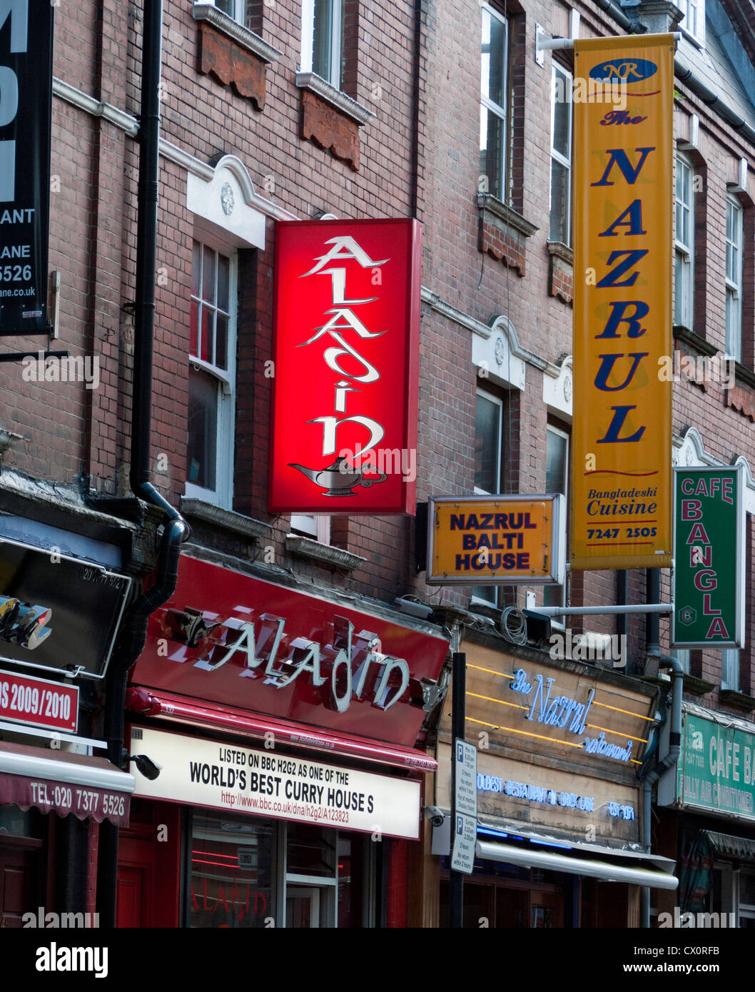 Signs of Indian restaurants in Brick Lane in east London Stock Photo