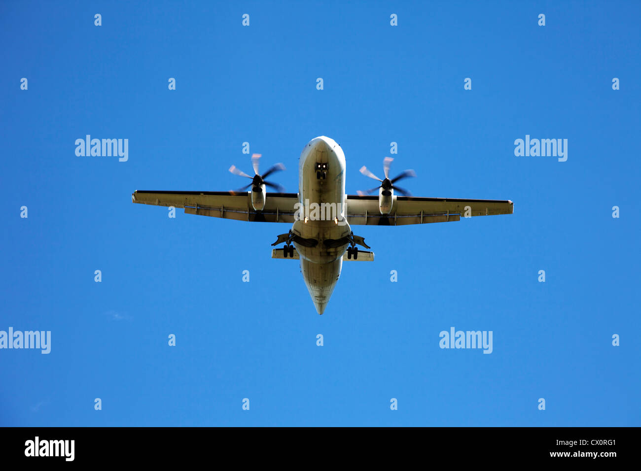 Airplane in the blue sky Stock Photo