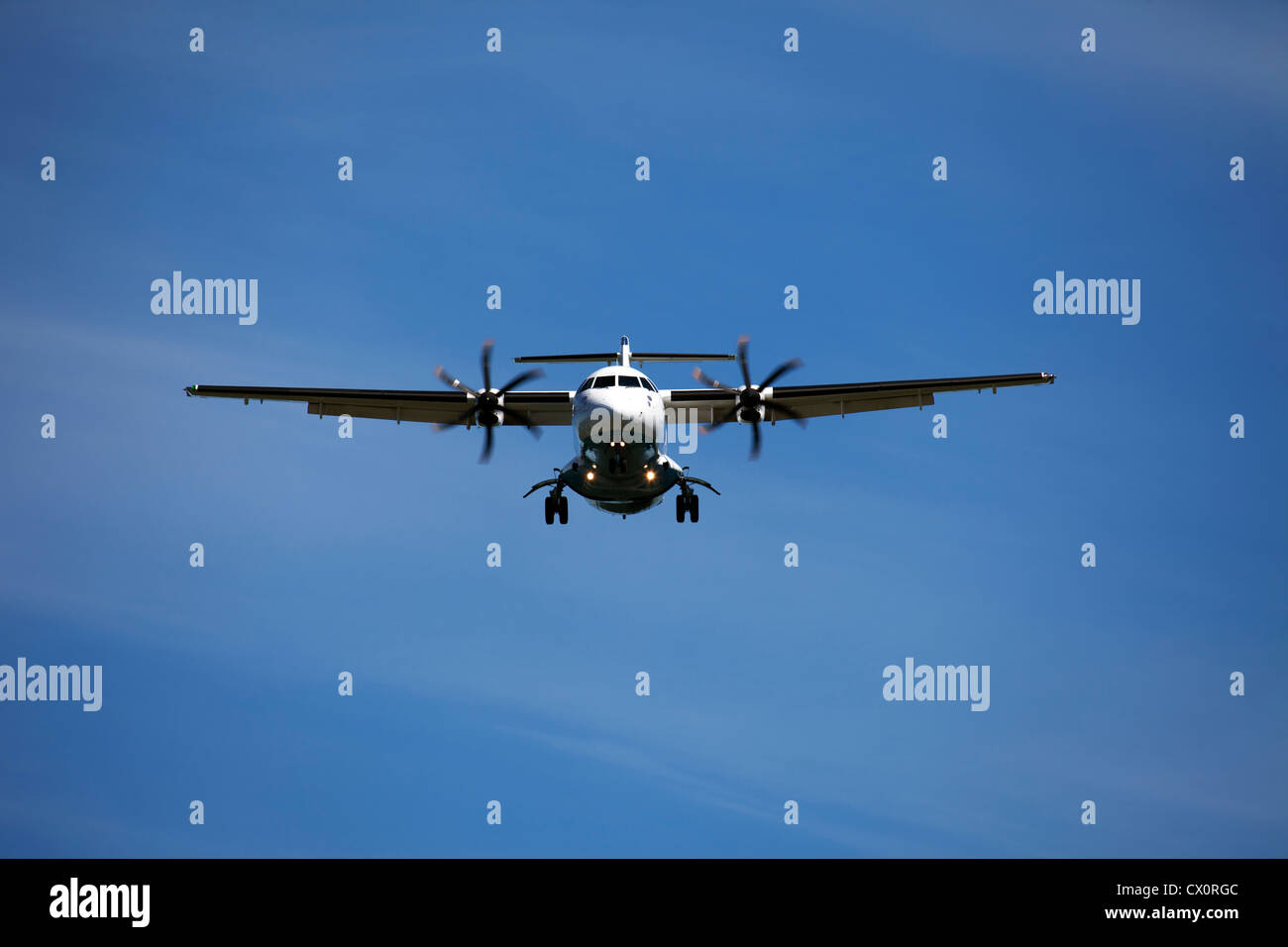 Airplane in the blue sky Stock Photo