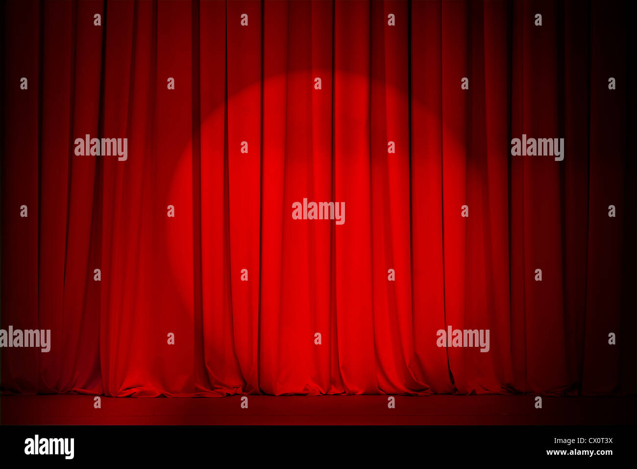 theatre red curtain with spotlight Stock Photo