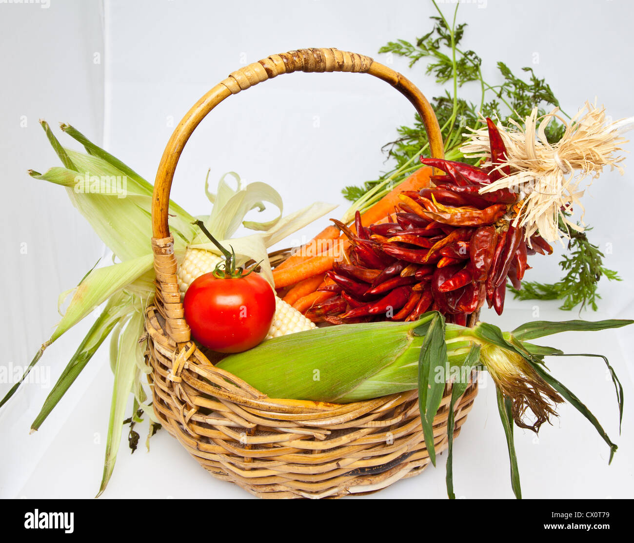 A basket of fresh vegetables in a wicker basket Stock Photo - Alamy