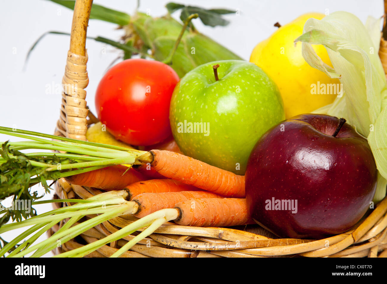 A basket of fresh vegetables in a wicker basket Stock Photo - Alamy