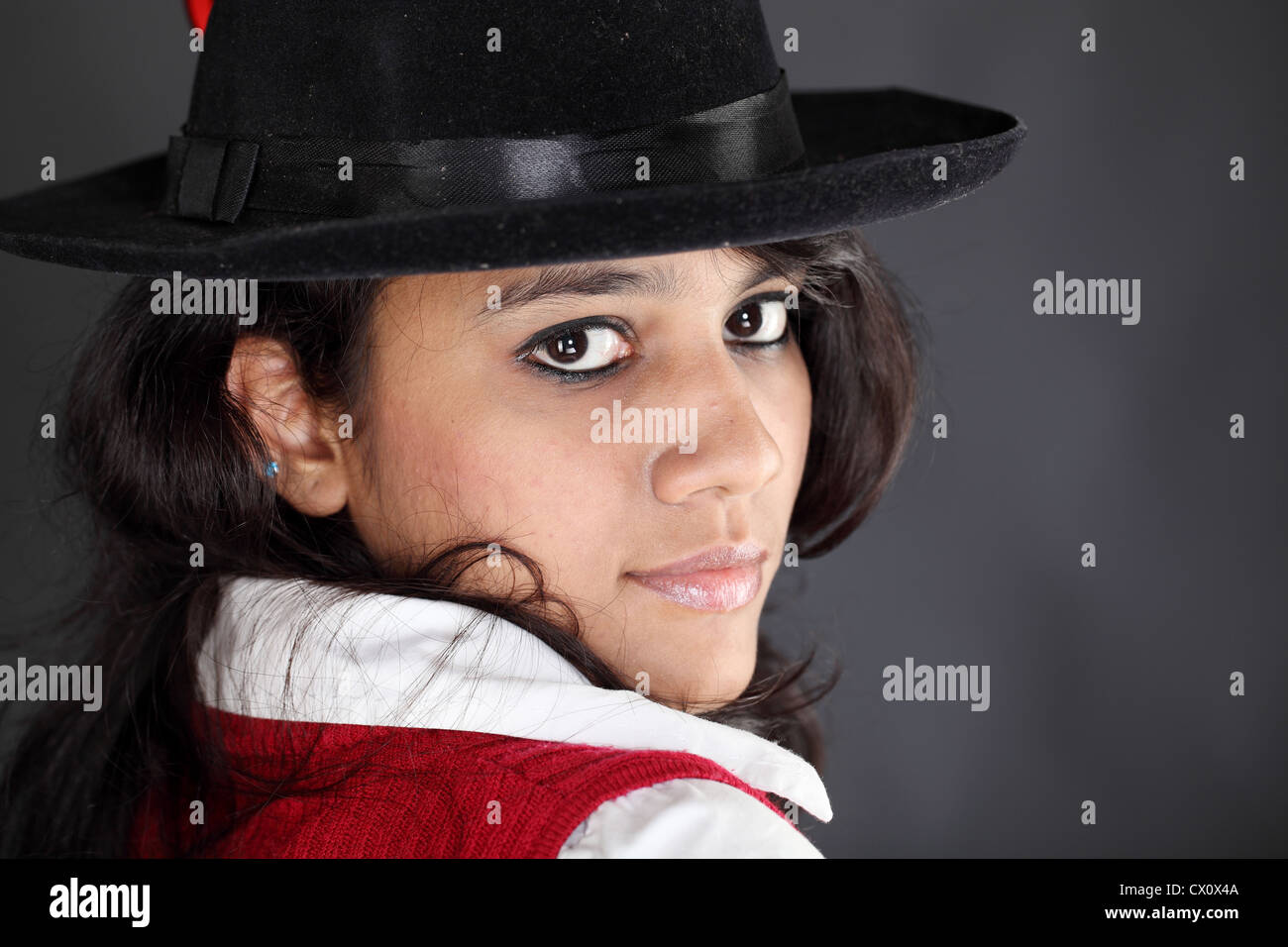 Head shot of teenage girl with black hat Stock Photo - Alamy