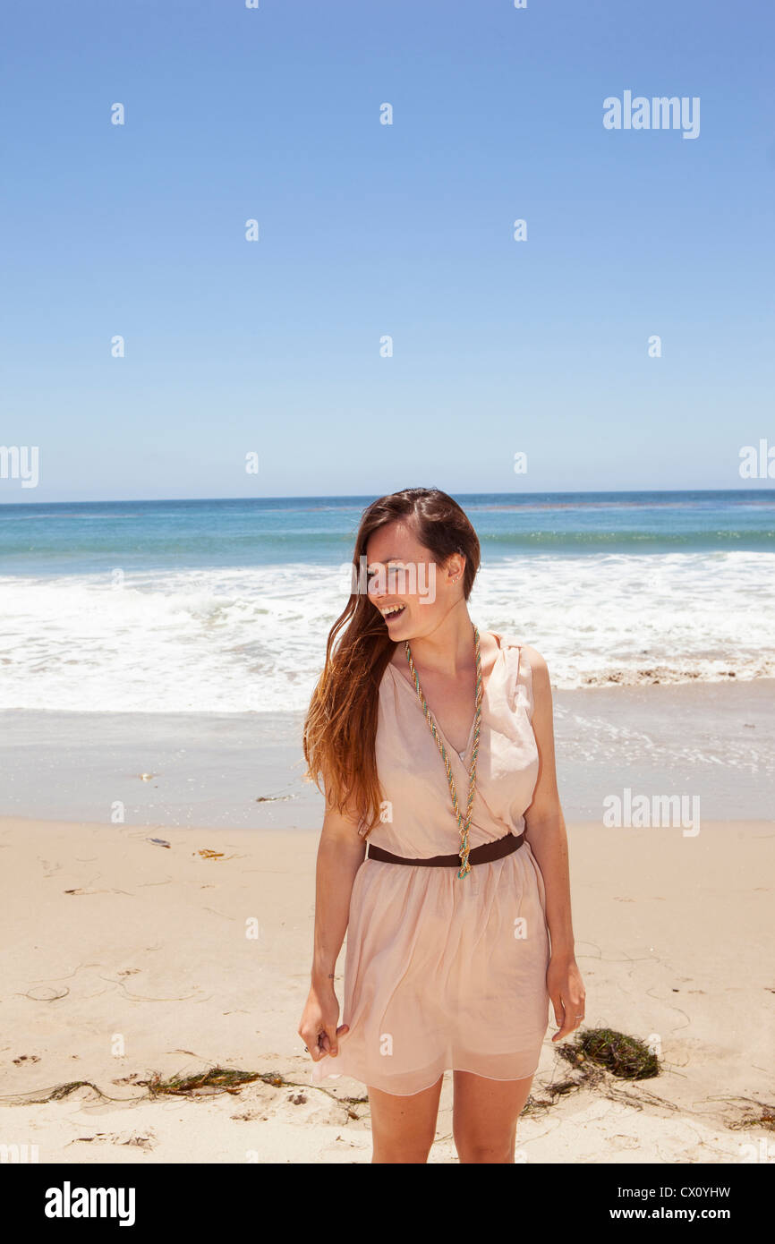 Happy young woman on a beach Stock Photo - Alamy