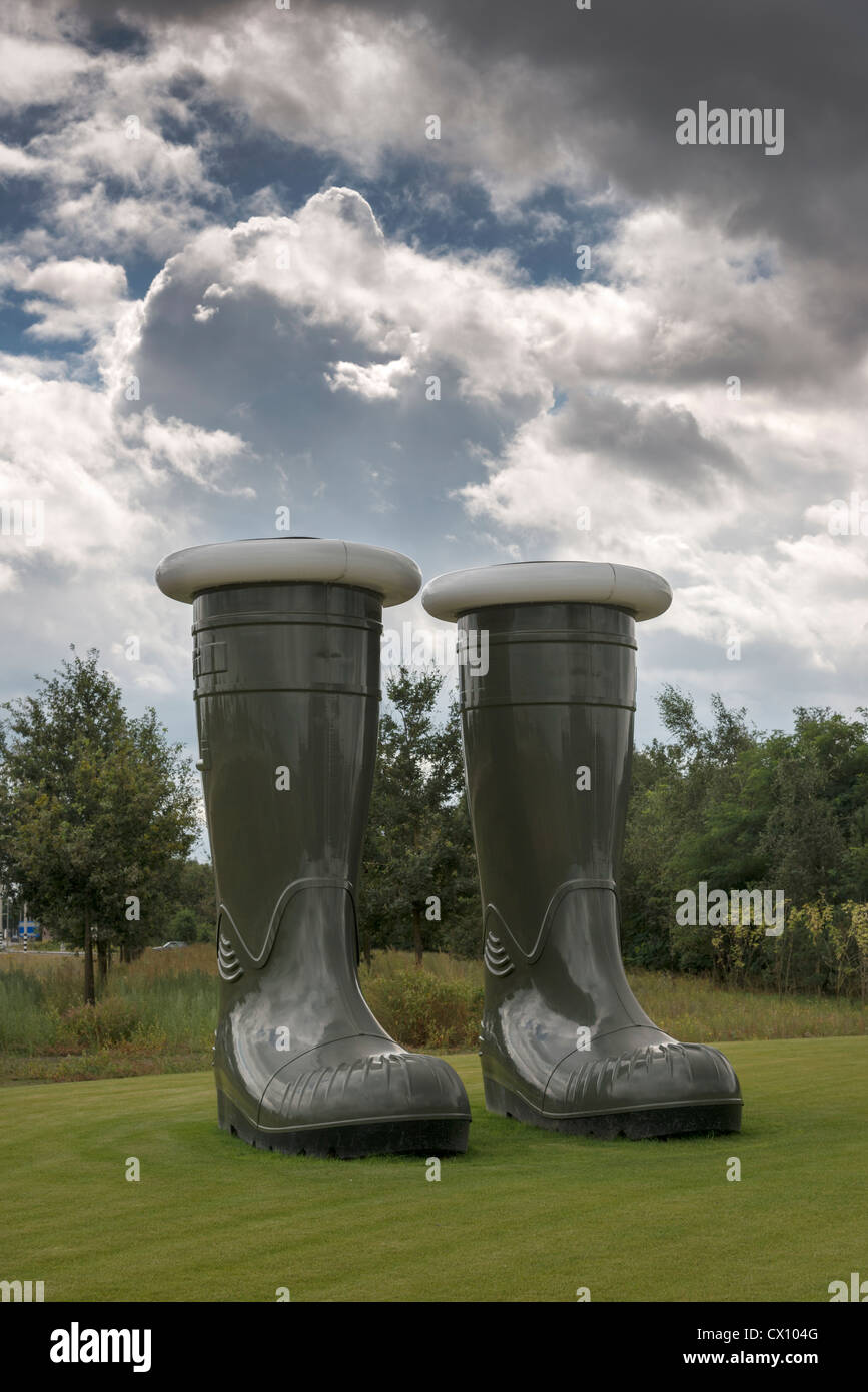 A gigantic pair of empty green wellington boots an exhibit at Floriade 2012 Netherlands Stock Photo
