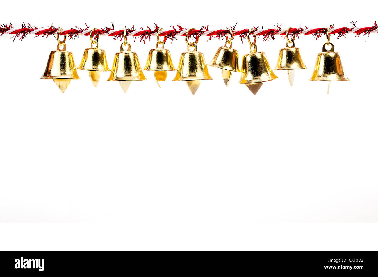 Golden bell holding ribbon rope isolate on white background Stock Photo ...