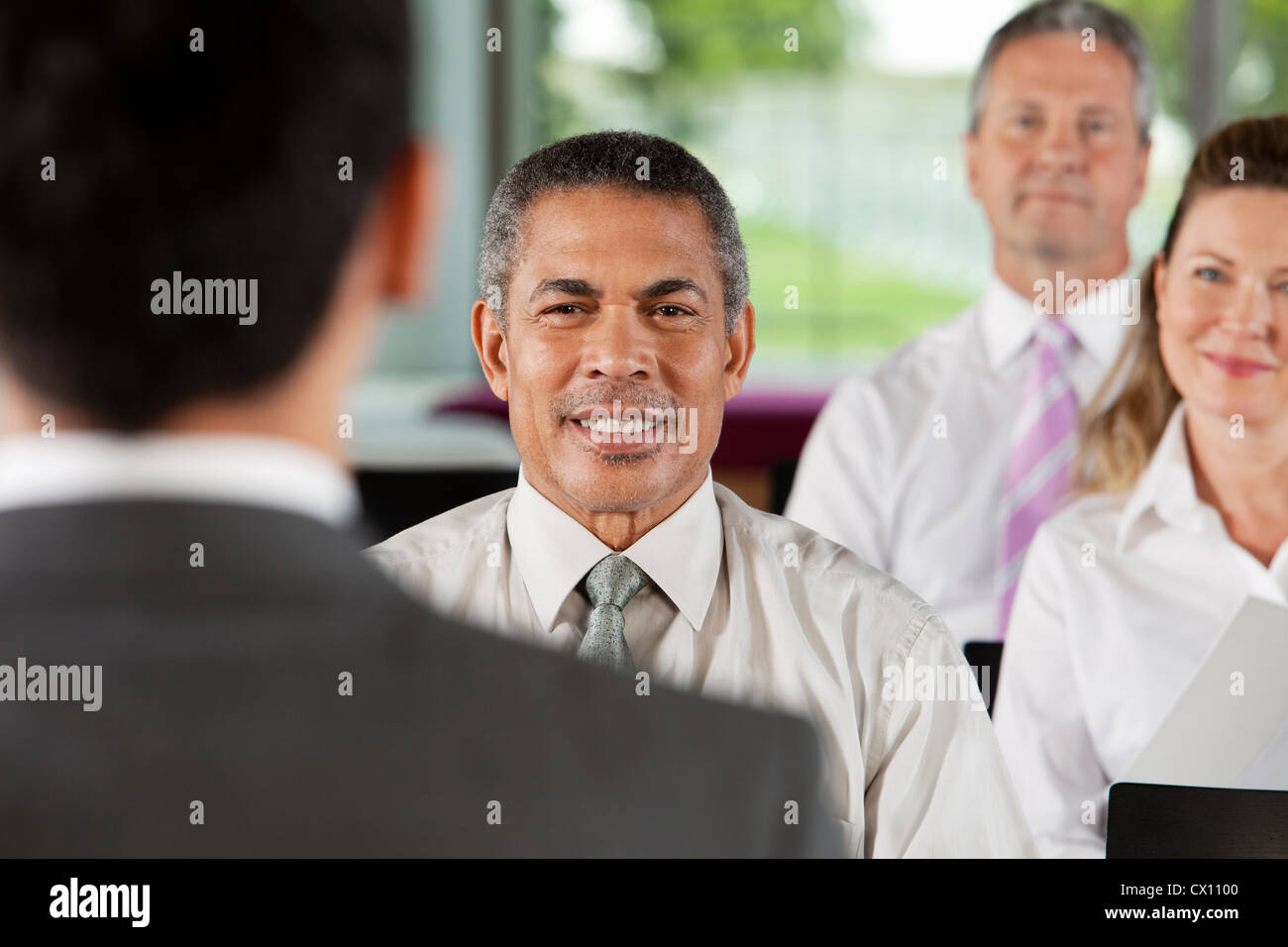 Businesspeople at presentation Stock Photo