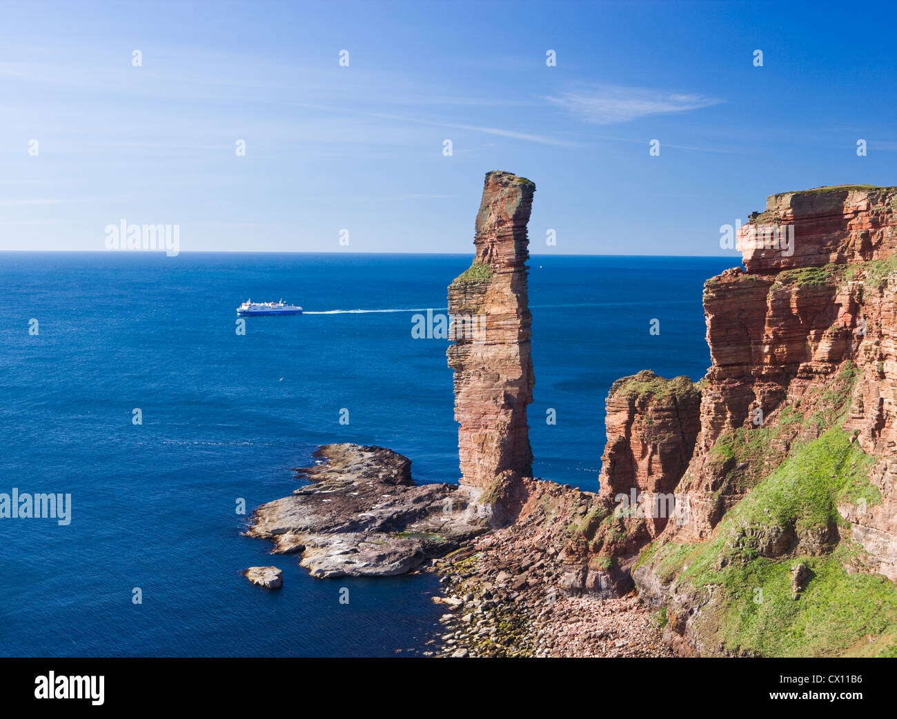 Old Man of Hoy with ferry passing, Hoy, Orkney Islands, Scotland, UK. Stock Photo