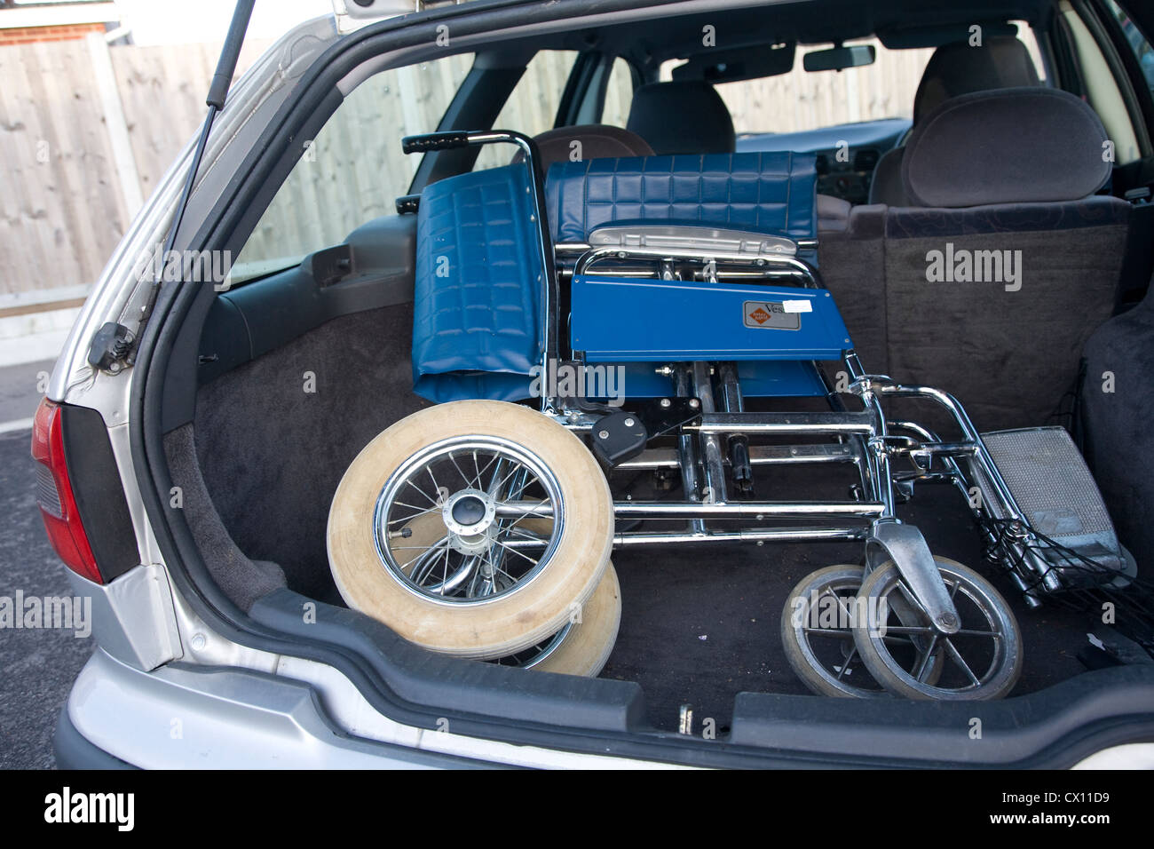 folded wheelchair in boot of car Stock Photo Alamy