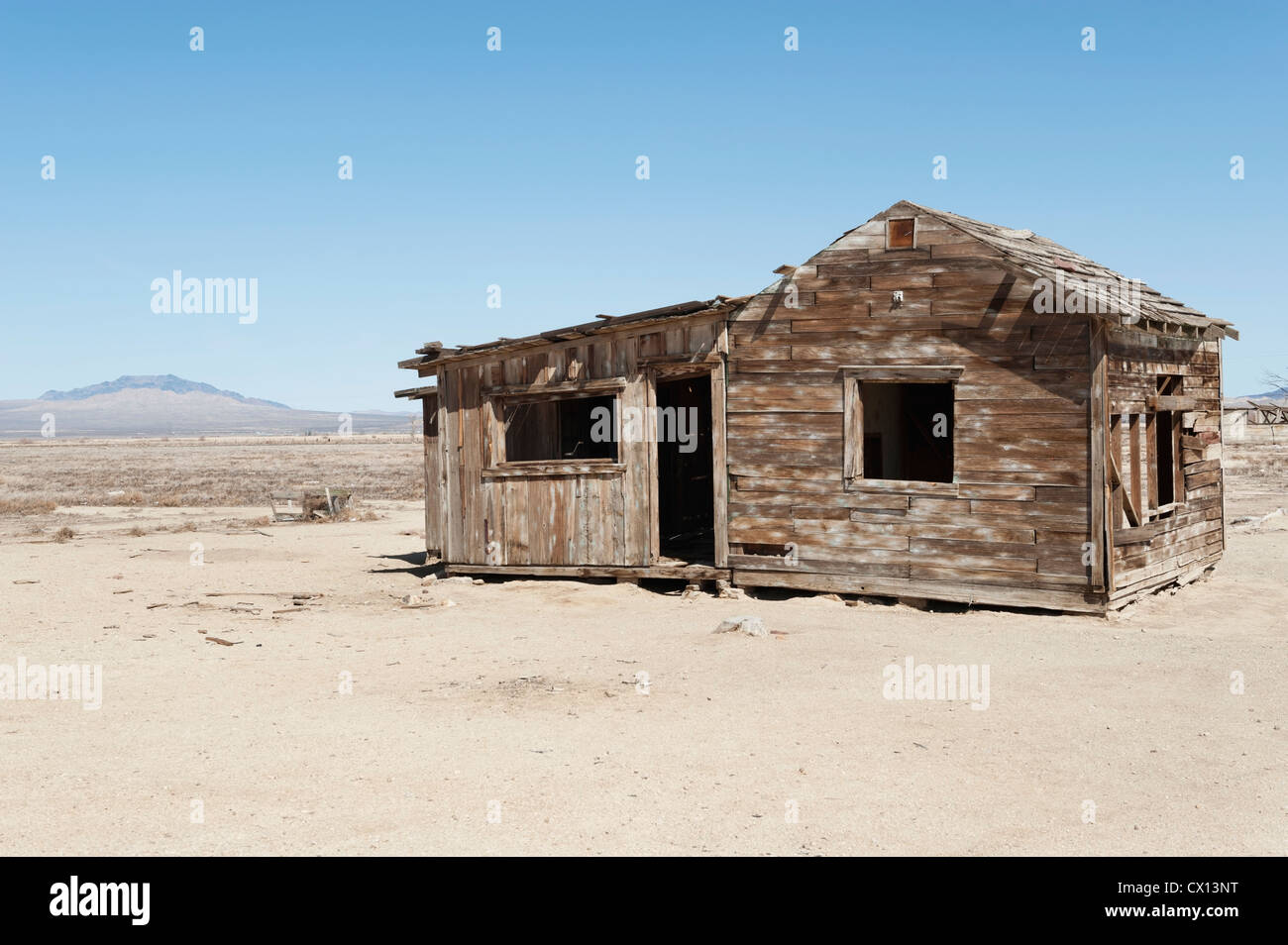 Timber home on arid landscape Stock Photo